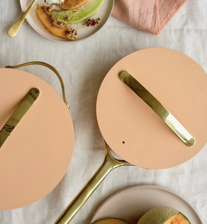 tan pots on white table cloth