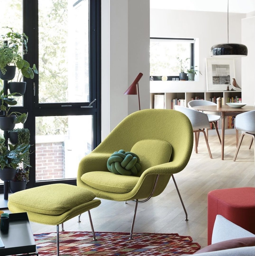 womb chair within modern living room by design within reach